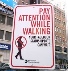 Pay attention while walking facebook sign