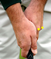 Two knuckles seen in golf grip